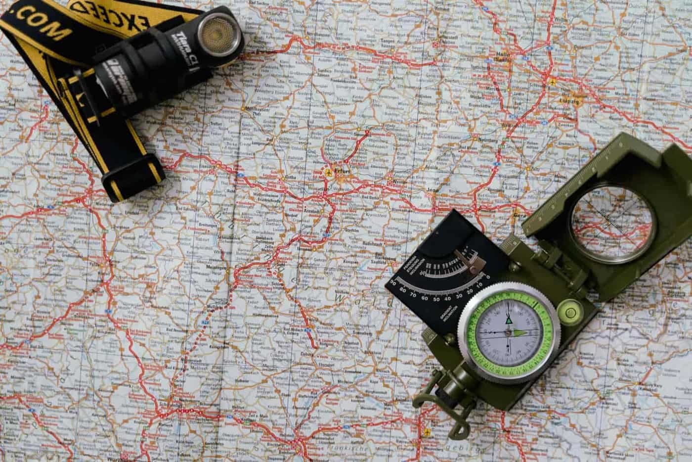 A map with a compass and a headlamp, seen from above